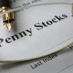 Page of newspaper with words penny stocks. Undervalued Penny Stocks